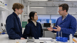Questions to Ask Before Choosing Your Next Study Destination - two students talk to their tutor in the lab